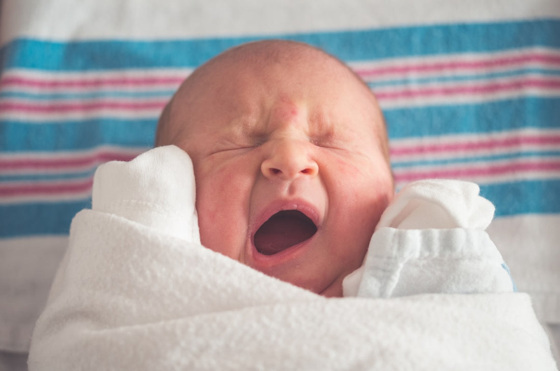 Sweet newborn baby yawning